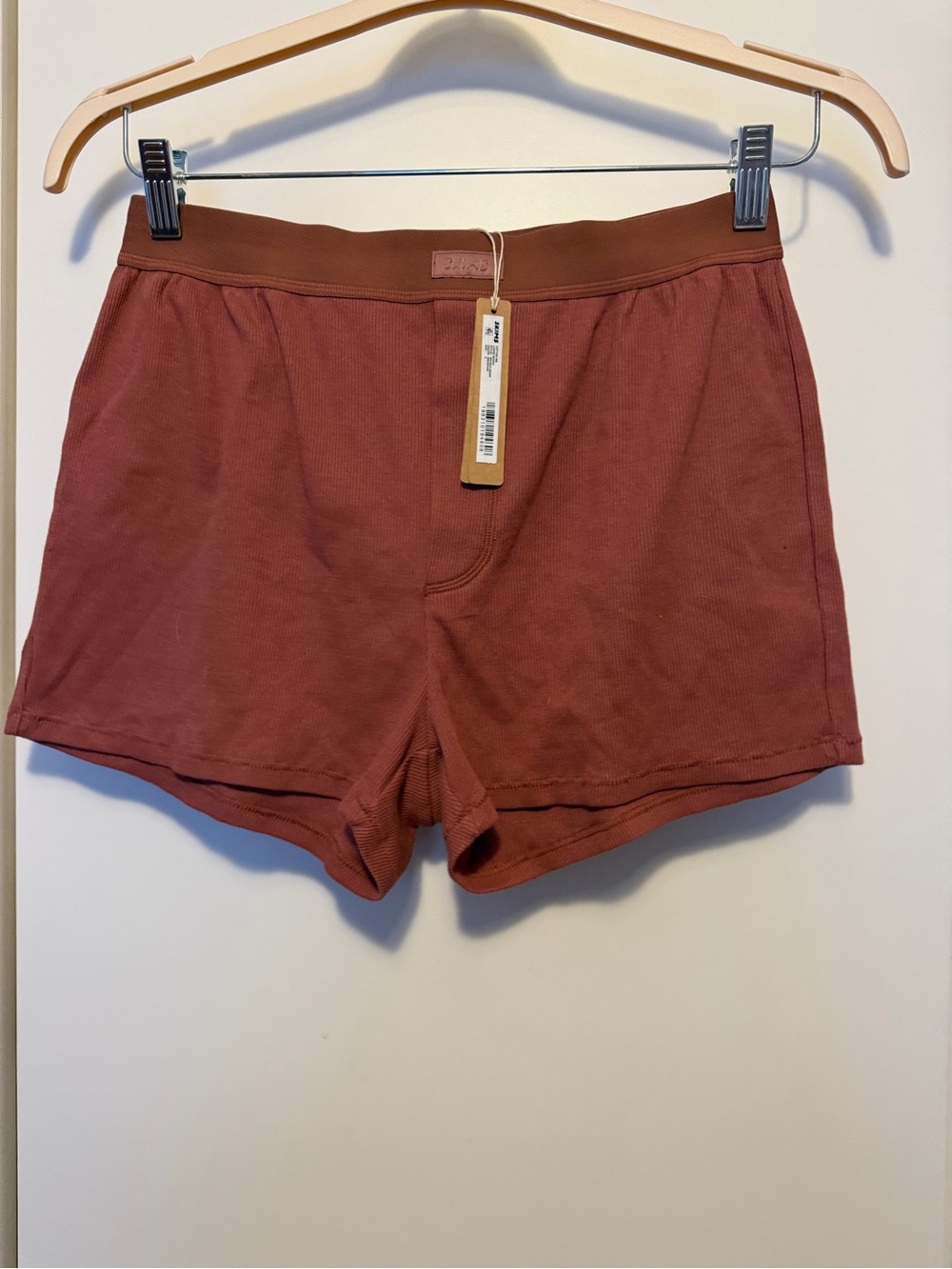 SKIMS Men's Ribbed Athletic Shorts in Rust
